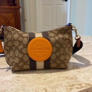 Original Coach print bag. Pre-loved & slightly dirty bag has some stains inside.